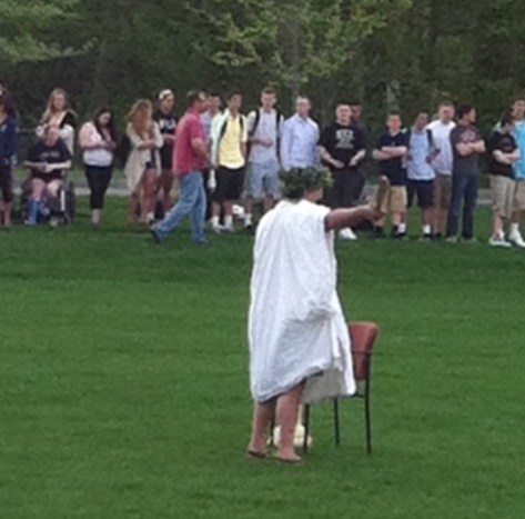 Caesar waves to the crowd.